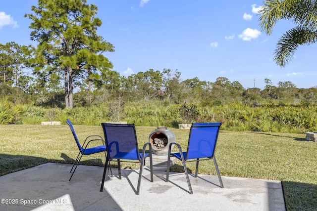 4554 Magenta Isles Dr, Melbourne, FL 32904 - view of patio / terrace featuring view of scattered trees