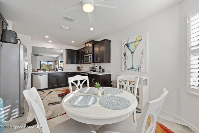 4554 Magenta Isles Dr, Melbourne, FL 32904 - dining room featuring a ceiling fan and recessed lighting