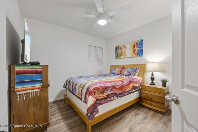 4554 Magenta Isles Dr, Melbourne, FL 32904 - bedroom with wood finished floors and ceiling fan