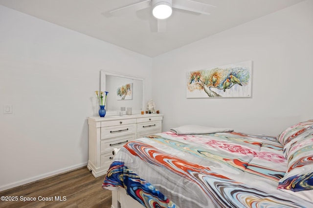 4554 Magenta Isles Dr, Melbourne, FL 32904 - bedroom featuring dark wood-style flooring, baseboards, and a ceiling fan