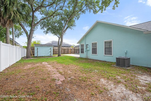 149 Kyle Ct NE, Palm Bay, FL 32907 - fenced backyard featuring central AC unit