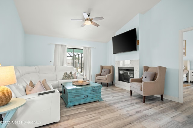 149 Kyle Ct NE, Palm Bay, FL 32907 - living room featuring vaulted ceiling, ceiling fan, wood finished floors, and a fireplace