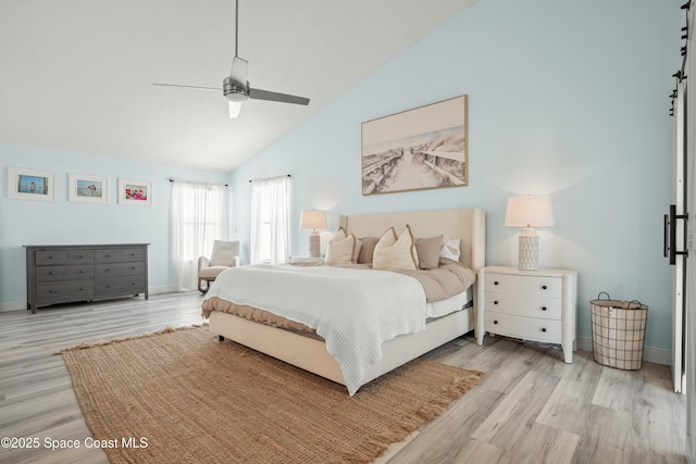 149 Kyle Ct NE, Palm Bay, FL 32907 - bedroom with light wood finished floors, high vaulted ceiling, baseboards, and a ceiling fan
