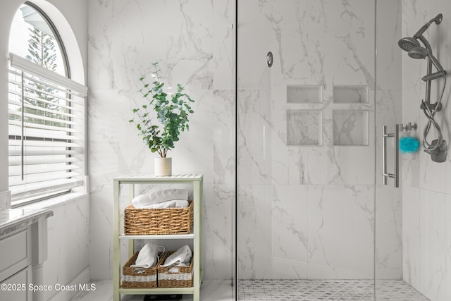 149 Kyle Ct NE, Palm Bay, FL 32907 - bathroom featuring a marble finish shower and vanity