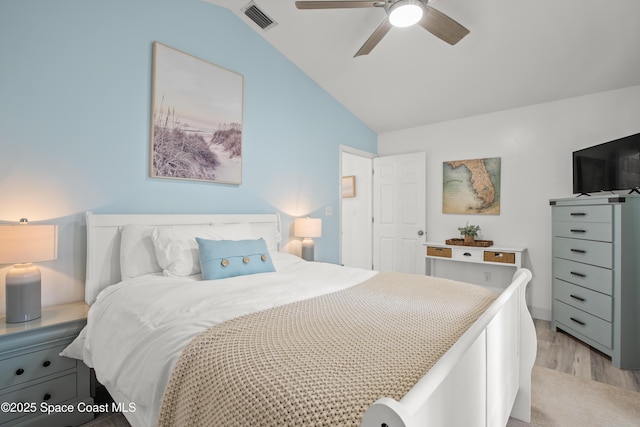 149 Kyle Ct NE, Palm Bay, FL 32907 - bedroom with light wood-style flooring, vaulted ceiling, and ceiling fan