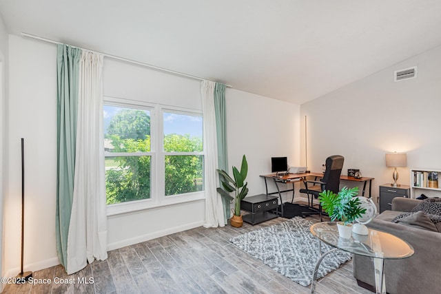 5145 Fay Blvd, Cocoa, FL 32927 - living room featuring wood finished floors, an office area, and baseboards