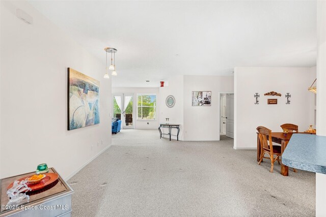 4341 Aberdeen Cir, Rockledge, FL 32955 - carpeted living room with baseboards