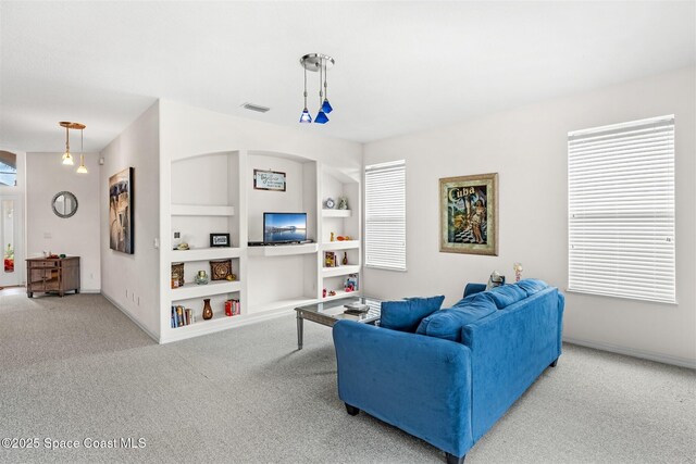 4341 Aberdeen Cir, Rockledge, FL 32955 - living room with carpet flooring, built in shelves, and baseboards