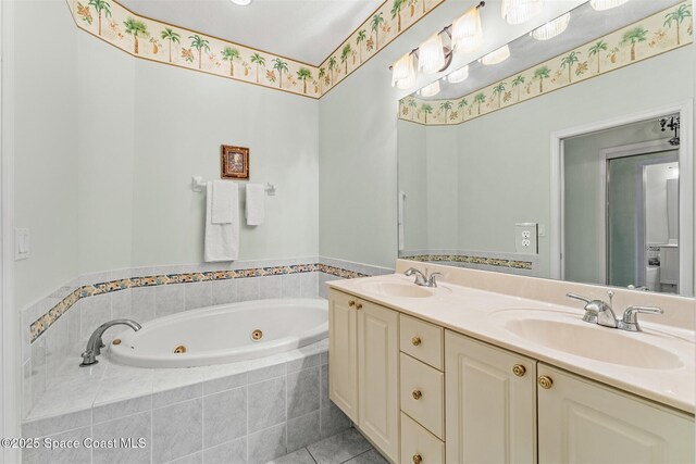 4341 Aberdeen Cir, Rockledge, FL 32955 - bathroom featuring a tub with jets, double vanity, and tile patterned floors