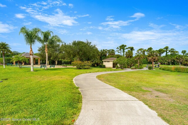 4341 Aberdeen Cir, Rockledge, FL 32955 - view of property's community with a gazebo, a yard, driveway, and view of scattered trees