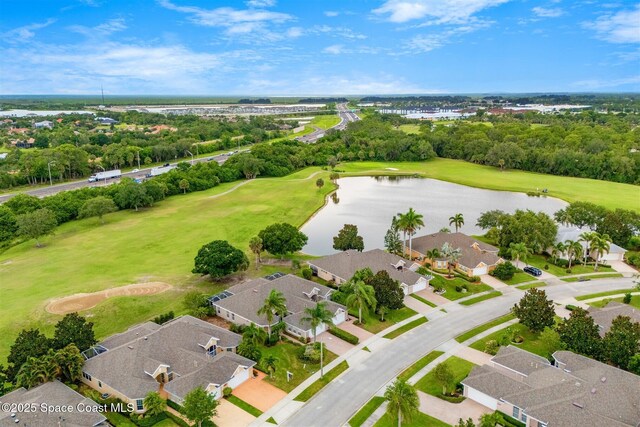 4341 Aberdeen Cir, Rockledge, FL 32955 - aerial perspective of suburban area with a large body of water, a tree filled landscape, and a golf course
