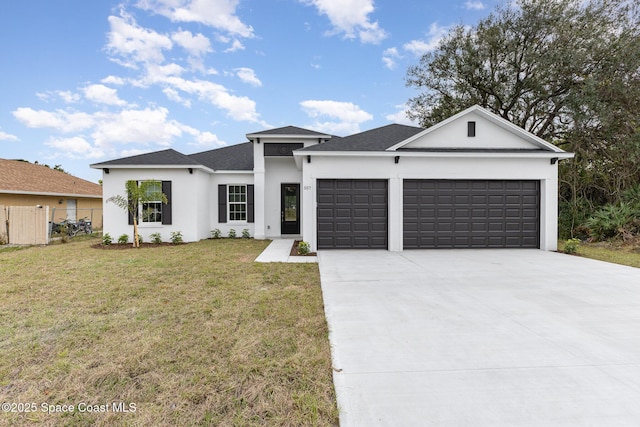 1795 Fallon Blvd NE Unit 06, Palm Bay, FL 32907 - view of front of house featuring a garage, driveway, stucco siding, and roof with shingles