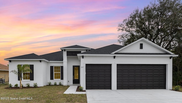 1795 Fallon Blvd NE Unit 06, Palm Bay, FL 32907 - view of front of home with an attached garage, driveway, stucco siding, roof with shingles, and a front yard