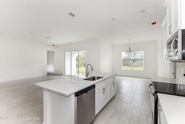 1795 Fallon Blvd NE Unit 06, Palm Bay, FL 32907 - kitchen featuring appliances with stainless steel finishes, a sink, open floor plan, and plenty of natural light