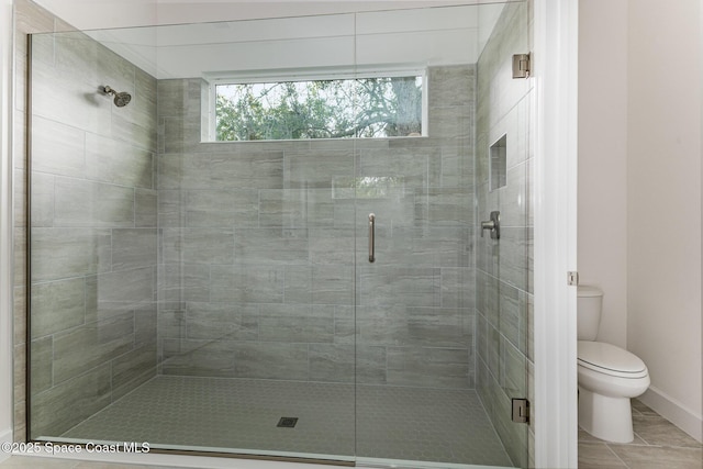 1795 Fallon Blvd NE Unit 06, Palm Bay, FL 32907 - full bathroom with a shower stall, toilet, and tile patterned floors