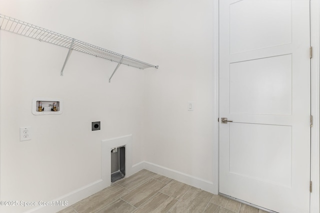 1795 Fallon Blvd NE Unit 06, Palm Bay, FL 32907 - laundry room with electric dryer hookup, hookup for a washing machine, baseboards, and wood tiled floors