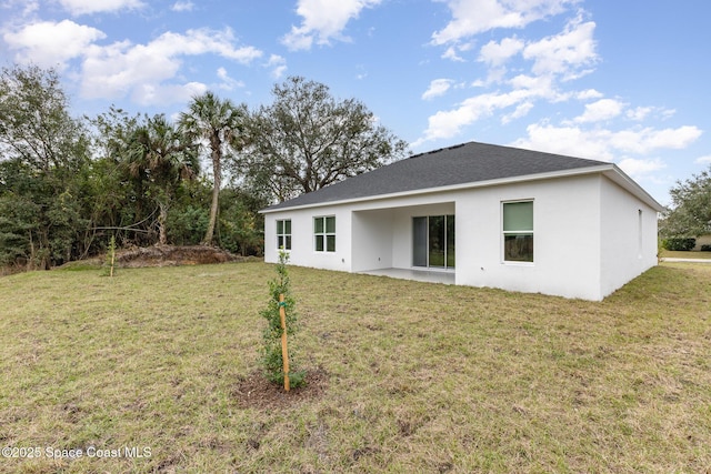 1795 Fallon Blvd NE Unit 06, Palm Bay, FL 32907 - back of property with a yard and stucco siding