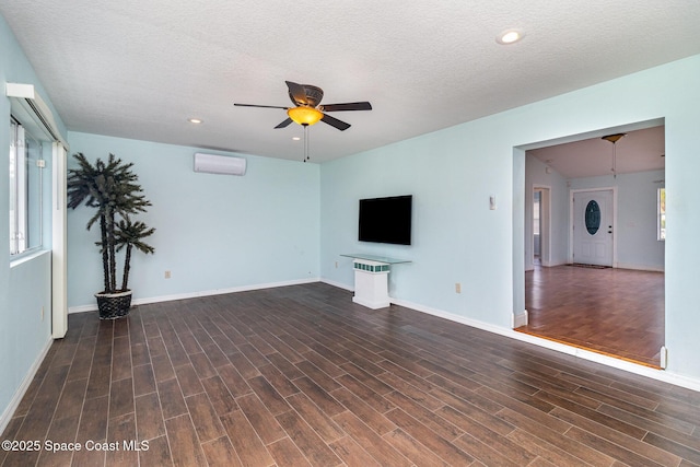 409 Americana Blvd NE, Palm Bay, FL 32907 - unfurnished living room with ceiling fan, a wall mounted AC, wood finished floors, baseboards, and recessed lighting