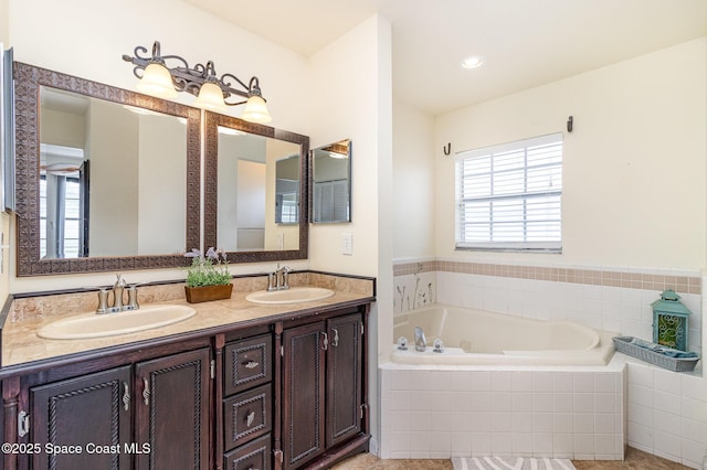 409 Americana Blvd NE, Palm Bay, FL 32907 - bathroom featuring double vanity and a garden tub
