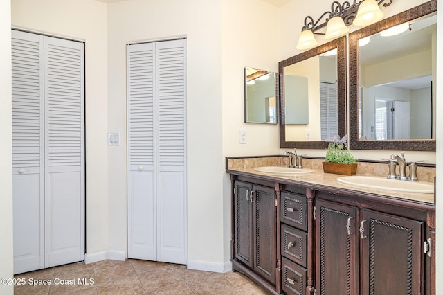 409 Americana Blvd NE, Palm Bay, FL 32907 - full bathroom featuring a closet and double vanity