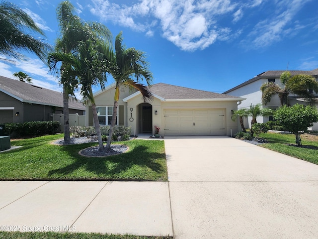 910 Swiss Pointe Ln, Rockledge, FL 32955 - ranch-style house with a garage, a front lawn, driveway, and stucco siding