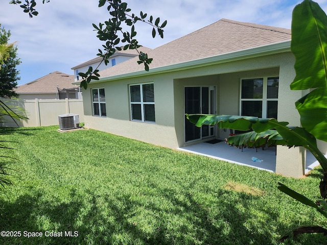 910 Swiss Pointe Ln, Rockledge, FL 32955 - back of property featuring stucco siding, a patio, roof with shingles, and central AC unit