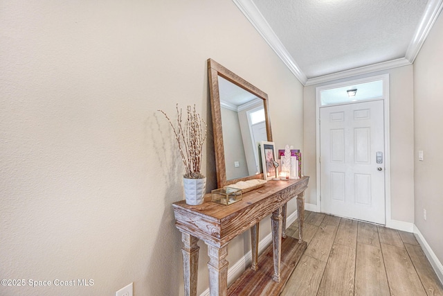 910 Swiss Pointe Ln, Rockledge, FL 32955 - entryway with light wood finished floors, crown molding, and a textured ceiling