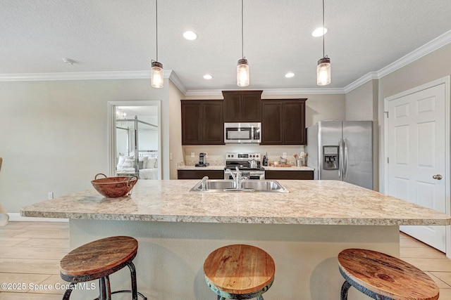 910 Swiss Pointe Ln, Rockledge, FL 32955 - kitchen featuring appliances with stainless steel finishes, light countertops, a kitchen bar, dark brown cabinets, and ornamental molding