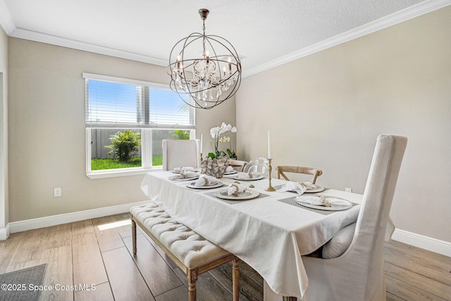 910 Swiss Pointe Ln, Rockledge, FL 32955 - dining area featuring a chandelier, light wood-type flooring, and ornamental molding