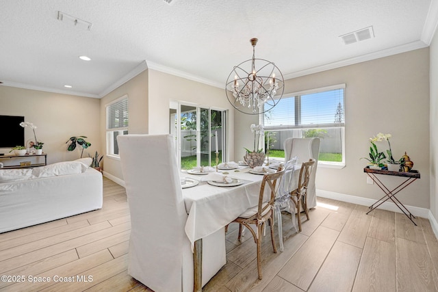 910 Swiss Pointe Ln, Rockledge, FL 32955 - dining room featuring light wood-type flooring, healthy amount of natural light, a chandelier, recessed lighting, and ornamental molding