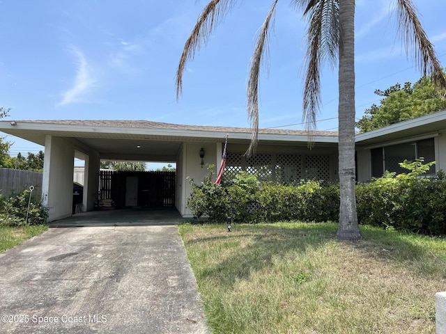 1899 Barker St NE, Palm Bay, FL 32907 - view of front facade with driveway and stucco siding