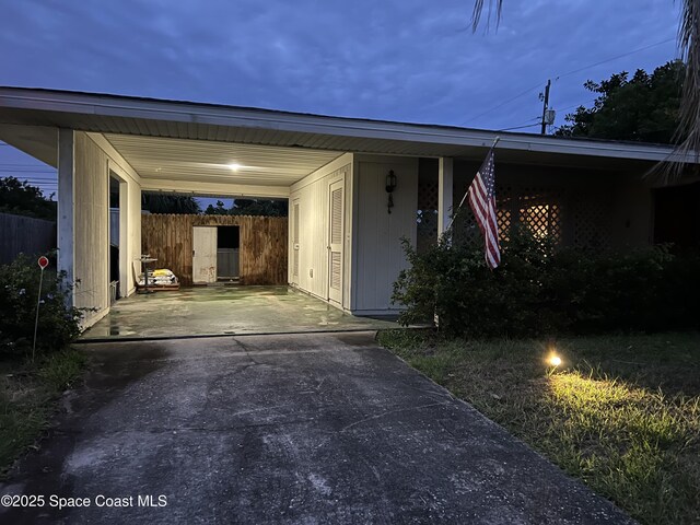 1899 Barker St NE, Palm Bay, FL 32907 - exterior space featuring driveway and a carport