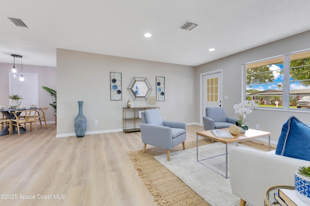 1340 Lester Ct, Merritt Island, FL 32952 - living room featuring light wood finished floors, recessed lighting, and baseboards