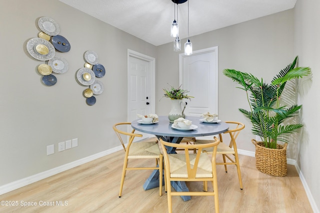 1340 Lester Ct, Merritt Island, FL 32952 - dining space with light wood-style floors and baseboards