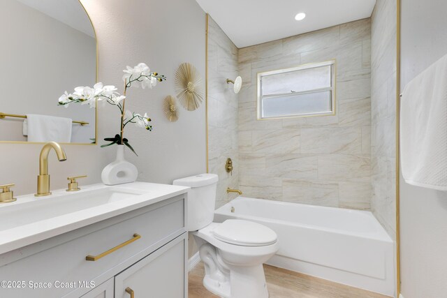 1340 Lester Ct, Merritt Island, FL 32952 - full bathroom with vanity, shower / bathtub combination, toilet, and wood finished floors