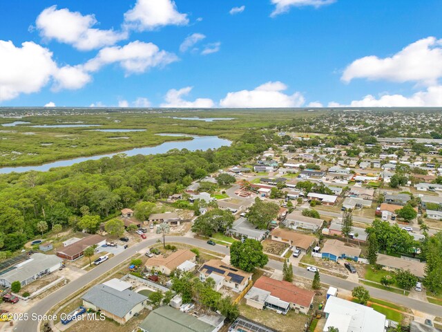 1340 Lester Ct, Merritt Island, FL 32952 - aerial view of property and surrounding area with a large body of water and nearby suburban area
