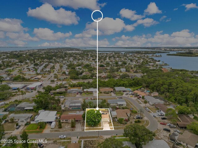 1340 Lester Ct, Merritt Island, FL 32952 - aerial overview of property's location with a nearby body of water, property boundaries highlighted, and nearby suburban area