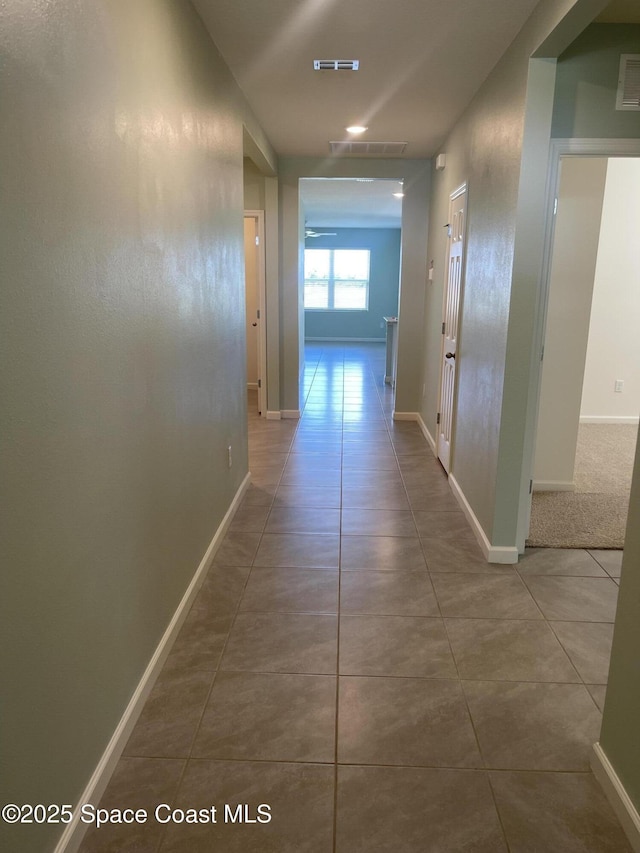 7055 Topaz Dr, Grant-Valkaria, FL 32949 - hallway featuring tile patterned floors
