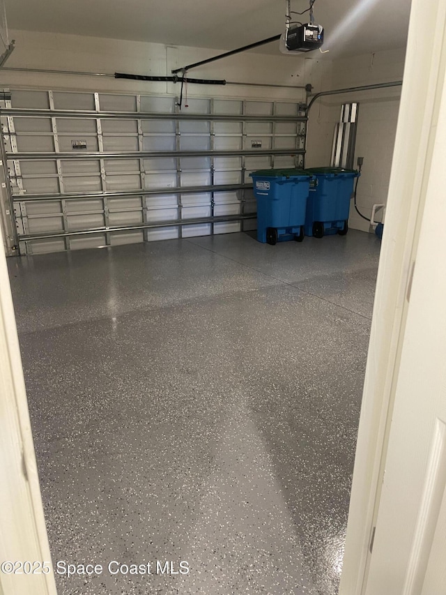 7055 Topaz Dr, Grant-Valkaria, FL 32949 - garage featuring a garage door opener