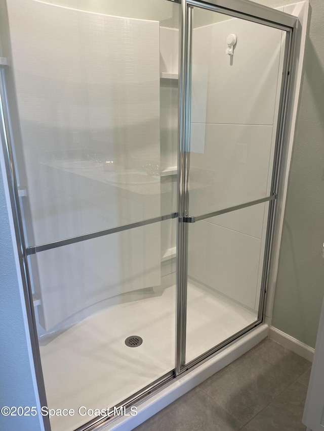 7055 Topaz Dr, Grant-Valkaria, FL 32949 - full bath with tile patterned flooring and a shower stall