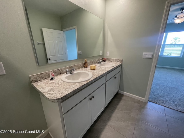 7055 Topaz Dr, Grant-Valkaria, FL 32949 - bathroom featuring double vanity and tile patterned flooring