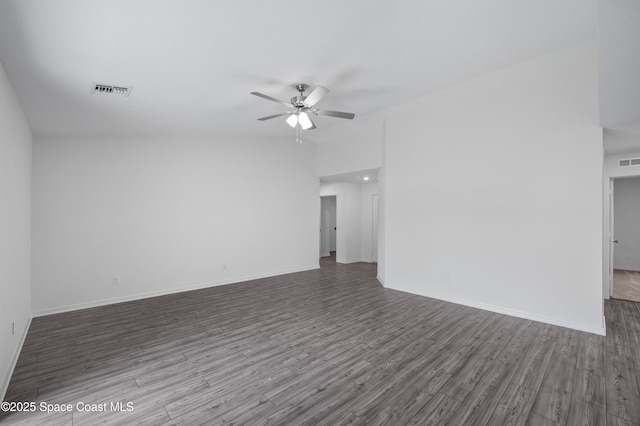 1422 Van Dyke Ave SE, Palm Bay, FL 32909 - spare room featuring ceiling fan, wood finished floors, and baseboards
