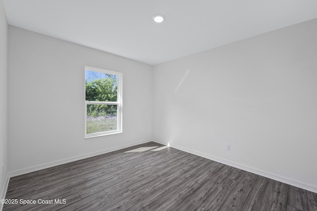 1422 Van Dyke Ave SE, Palm Bay, FL 32909 - unfurnished room featuring dark wood-style floors, baseboards, and recessed lighting