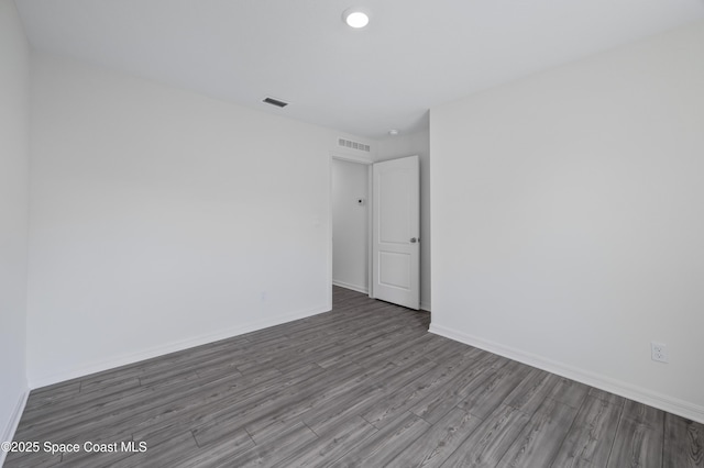 1422 Van Dyke Ave SE, Palm Bay, FL 32909 - empty room with wood finished floors and baseboards