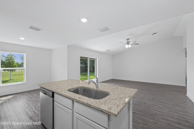 1422 Van Dyke Ave SE, Palm Bay, FL 32909 - kitchen featuring dishwasher, a sink, open floor plan, plenty of natural light, and recessed lighting