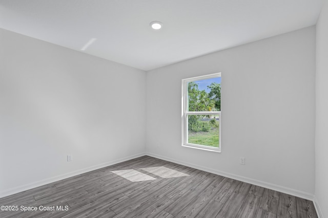 1422 Van Dyke Ave SE, Palm Bay, FL 32909 - empty room with wood finished floors and baseboards