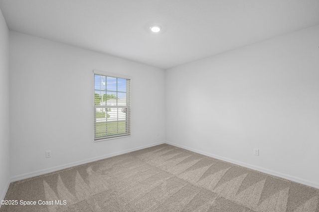 1422 Van Dyke Ave SE, Palm Bay, FL 32909 - carpeted empty room featuring baseboards and recessed lighting