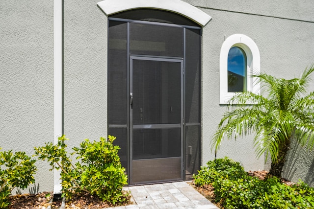 2611 Ballydoyle Ln, Melbourne, FL 32940 - doorway to property featuring stucco siding