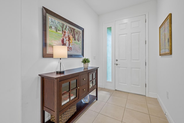 2611 Ballydoyle Ln, Melbourne, FL 32940 - foyer entrance featuring light tile patterned flooring and baseboards