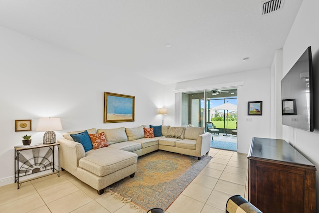 2611 Ballydoyle Ln, Melbourne, FL 32940 - living area with light tile patterned floors and a ceiling fan